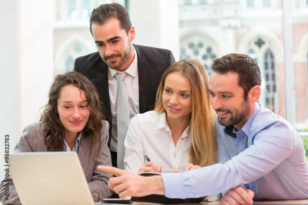Group of business people working together at the office Group of business people working together at the office
