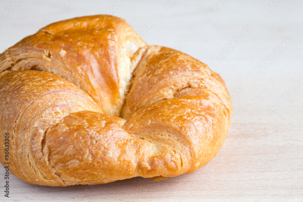 Fresh croissant on a wooden board Fresh croissant on a wooden board