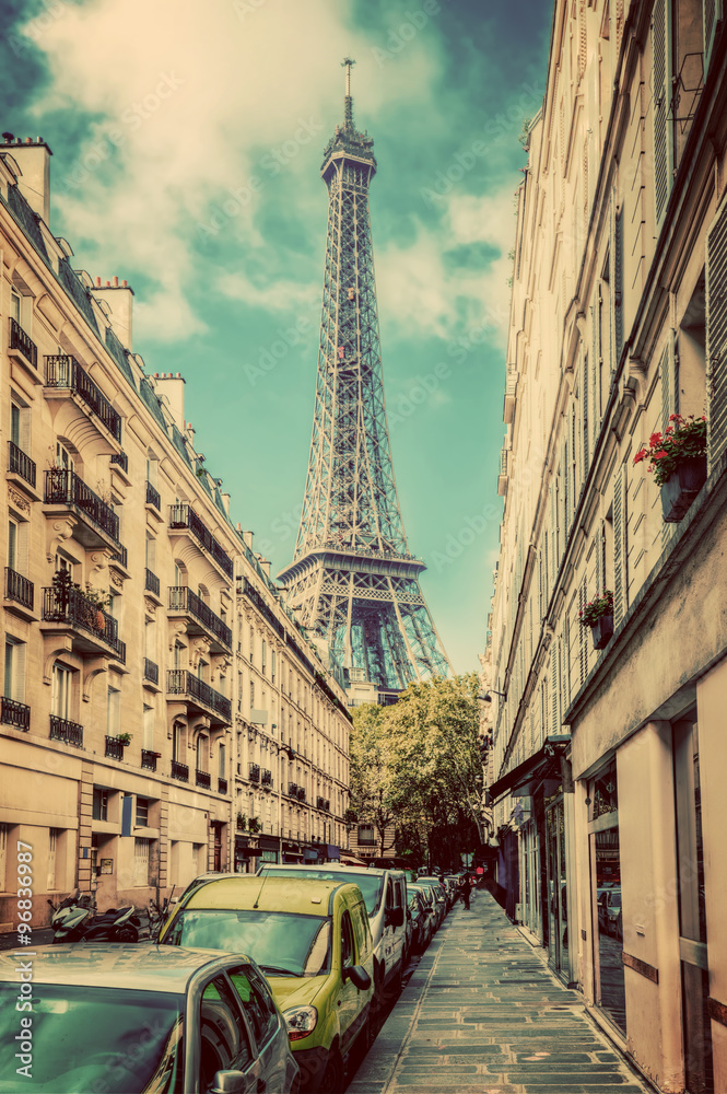Fototapeta premium Eiffel Tower seen from the street in Paris, France. Vintage