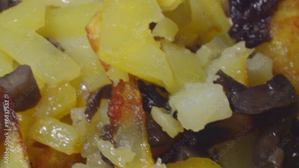 Fried potatoes with mushrooms on the plate Fried potatoes with mushrooms on the plate