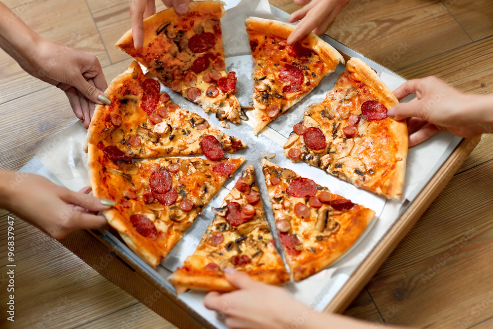 Eating Pizza. Group Of Friends Sharing Pizza Together. People Hands Taking  Slices Of Pepperoni Pizza. Fast Food, Friendship, Leisure, Lifestyle. Stock  Photo