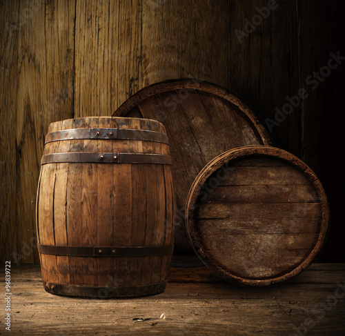 Beer barrel with beer glasses on a wooden table. 