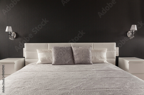 Elegant bed in master bedroom photo