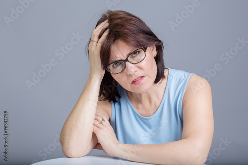 Middle age woman having a headache