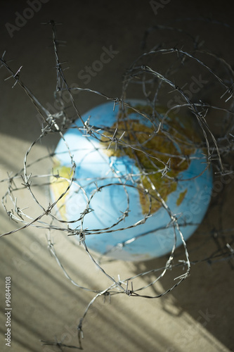 globe with barbed wire