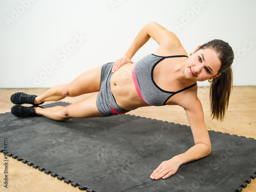 Woman doing side elbow plank