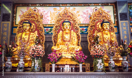 Golden buddha statues in chinese temple