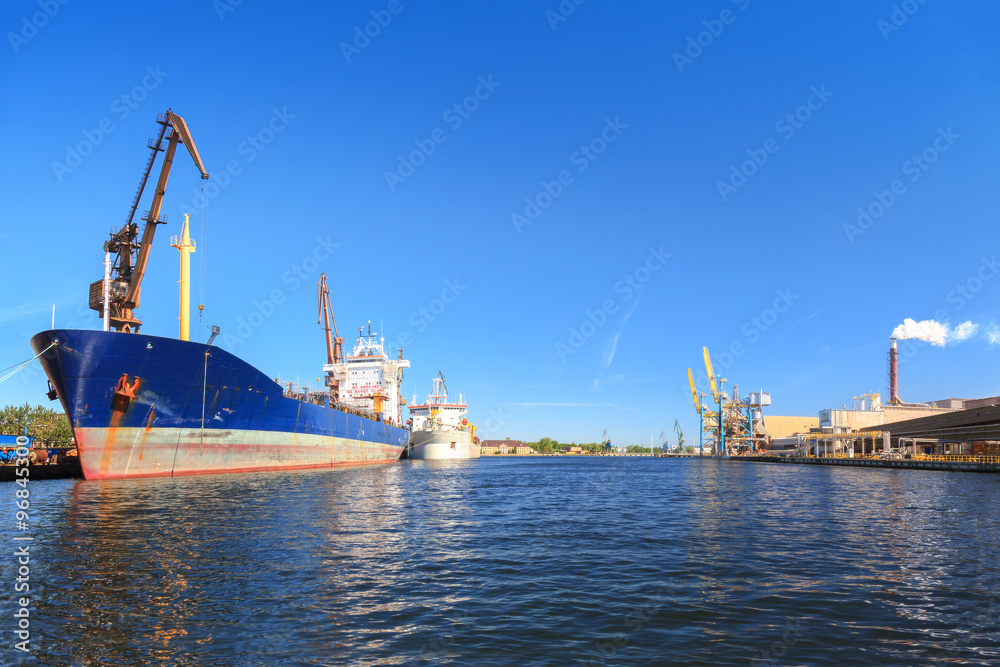 A big ship loading cargo at port of Gdansk, Poland.