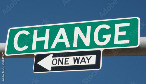 Change on green overhead highway sign with one way arrow  © Rex Wholster