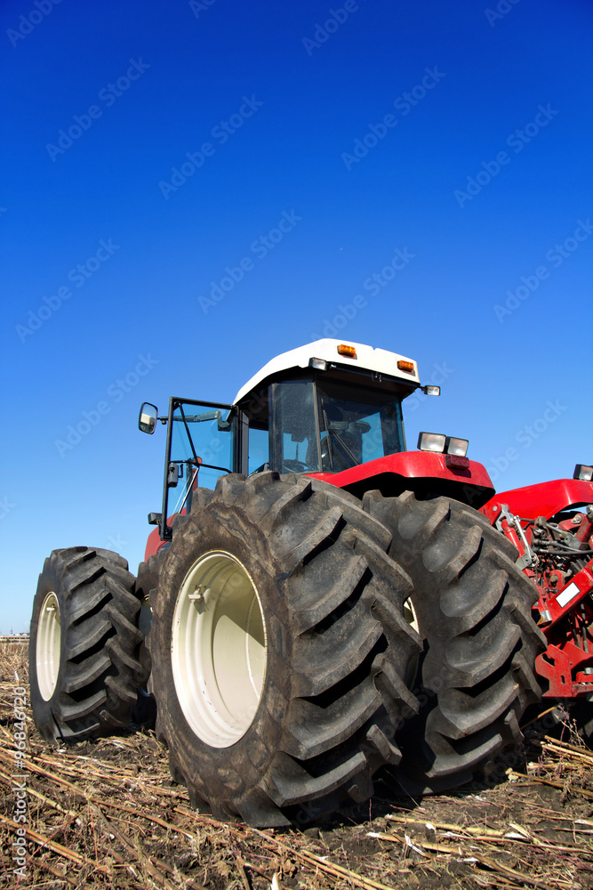 Powerful agricultural tractor in a field Powerful agricultural tractor in a field