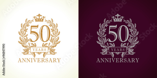 50 anniversary luxury logo. Template logo 50th royal anniversary with a frame in the form of laurel branches and the number fifty. photo