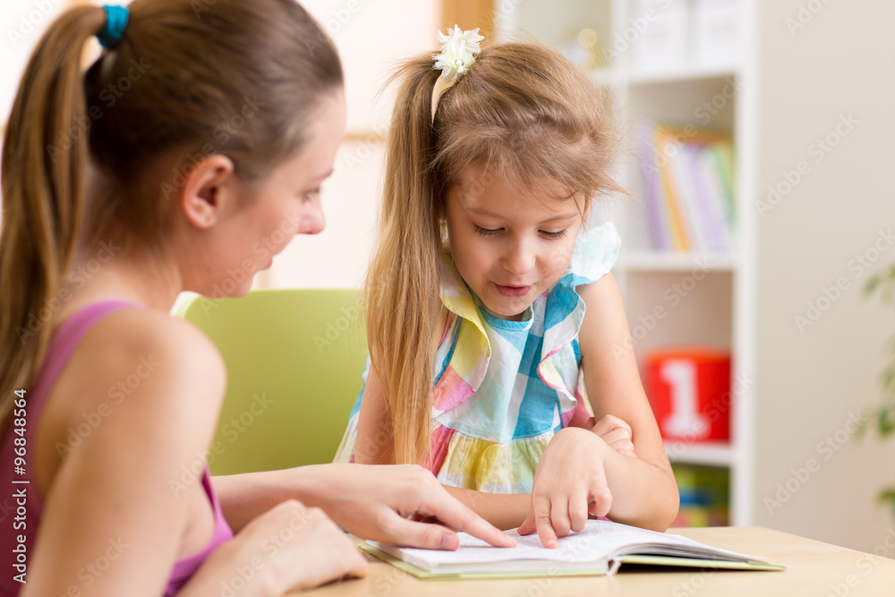 Mother teaching child daughter to reading Mother teaching child daughter to reading