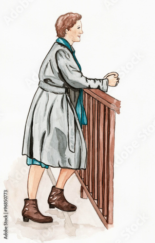 Frau an einem Geländer