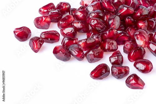 Pomegranate seeds on  white background