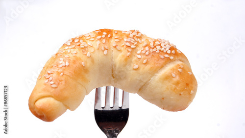 Fresh bakery with sesame on a fork