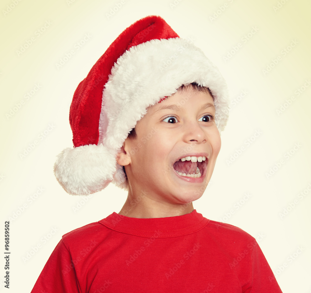 boy in santa helper hat portrait - winter holiday christmas concept boy in santa helper hat portrait - winter holiday christmas concept