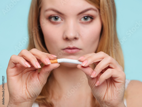 Girl breaking up with cigarette.