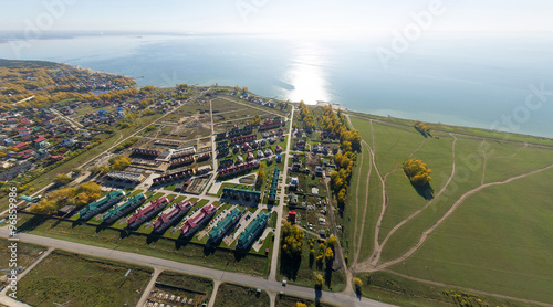Aerial view of a summer house village at blue sea coast. photo