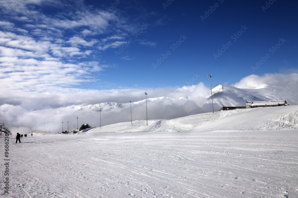 Ski slope at sun wind day