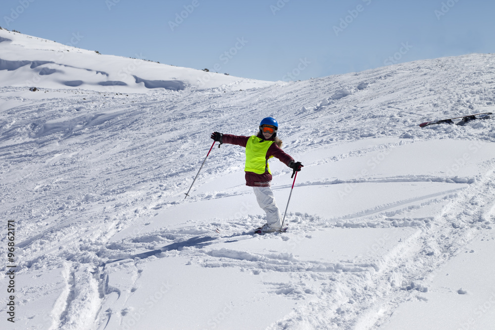 Little skier on ski slope with new fallen snow at sun day Little skier on ski slope with new fallen snow at sun day
