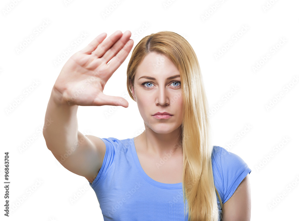Attractive blonde woman with her hand holding it at arm's length Attractive blonde woman with her hand holding it at arm's length