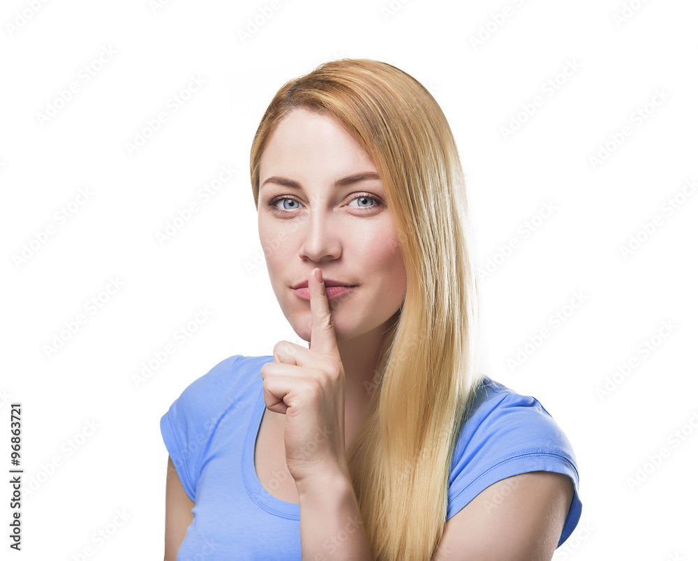 Blonde holding a finger to her mouth. Blonde holding a finger to her mouth.