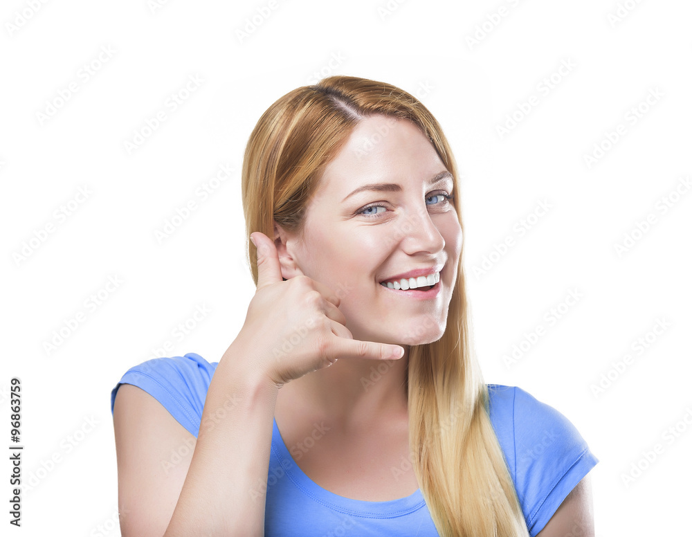 Blonde gesturing phone sign and smiling. Isolated on white. Blonde gesturing phone sign and smiling. Isolated on white.