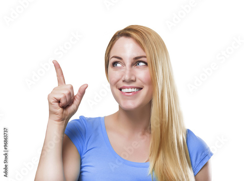 Blonde pointing a finger upwards