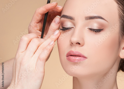 Experienced beautician is working at beauty salon