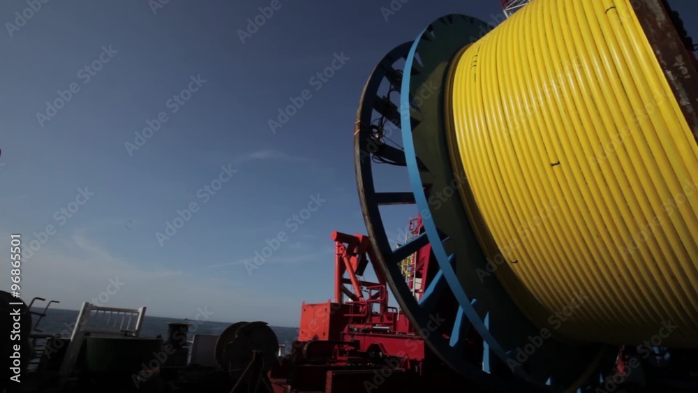 Laying of underwater optical cable on sea bottom