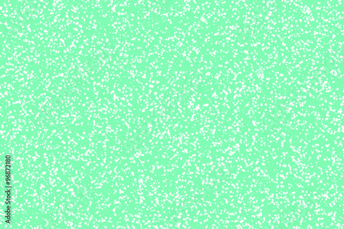 Snowflakes on green background. Chaotic dotted pattern for Christmas and New year design.
