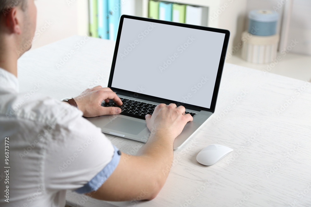 Man working with laptop in office Man working with laptop in office