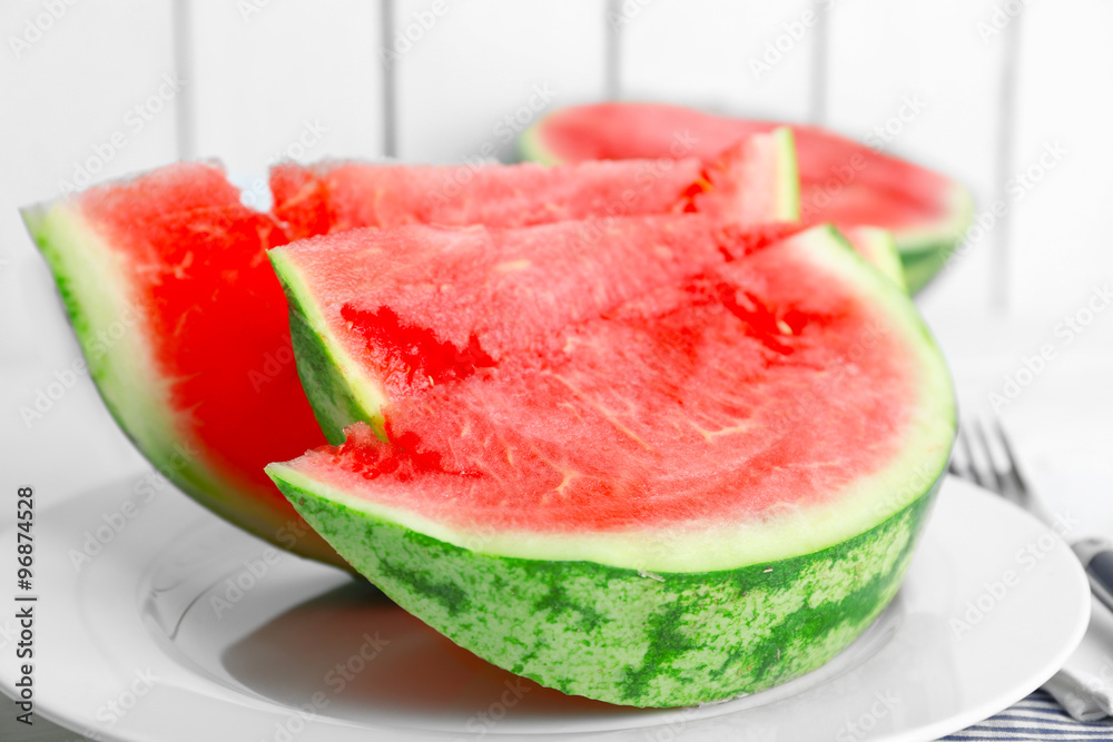 Sliced watermelon on white plate Sliced watermelon on white plate