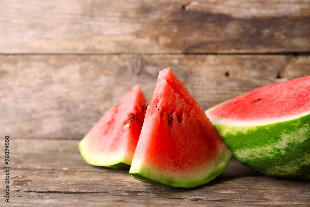 Fresh sliced watermelon wooden background Fresh sliced watermelon wooden background