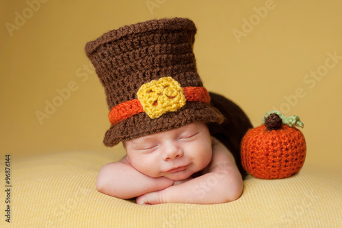 Smiling Newborn Baby Boy Wearing a Pilgrim Hat