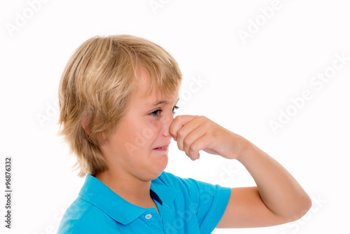 Slika na platnu blond boy holding his nose