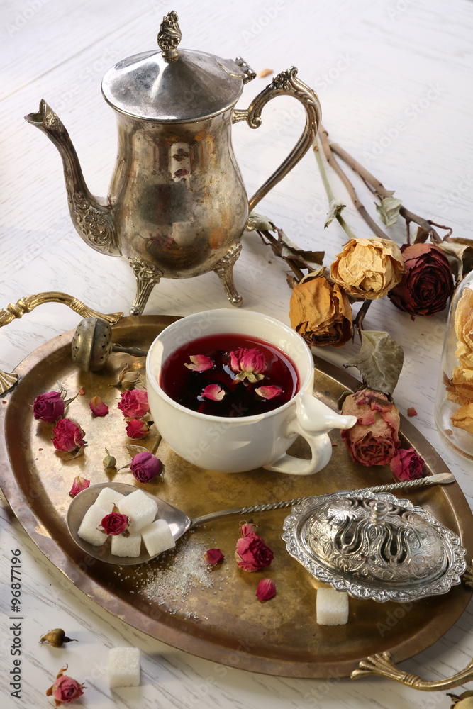 Fototapeta premium Hot rose tea on metal tray