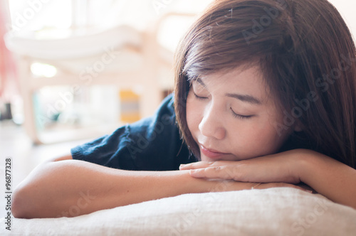 Free Download Young asian woman napping. - GFXLoad