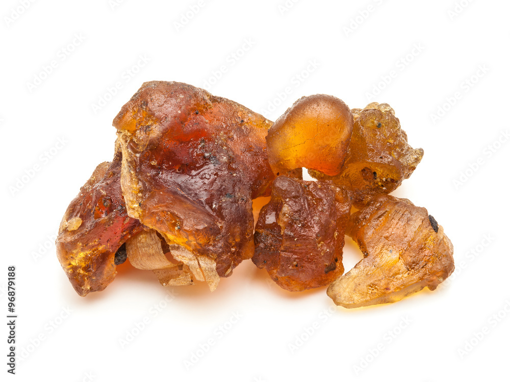 Macro closeup of Organic Indian bdellium or Guggul resin (Commiphora wightii) isolated on white background. Macro closeup of Organic Indian bdellium or Guggul resin (Commiphora wightii) isolated on white background.