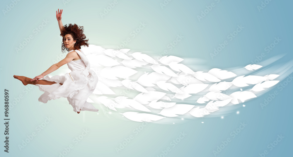 Healthy young woman jumping with feathers around her Healthy young woman jumping with feathers around her
