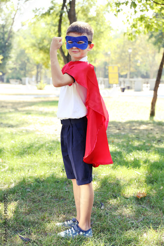 Boy dressed as superhero wi...