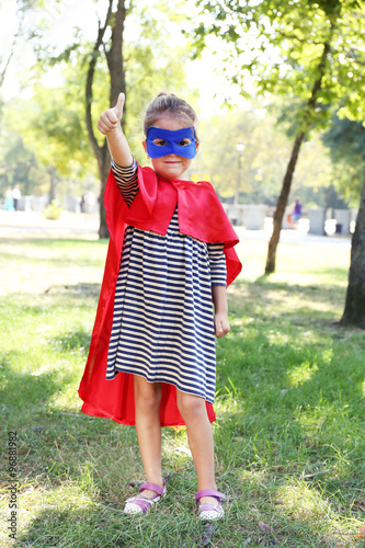 Cute little girl dressed as...