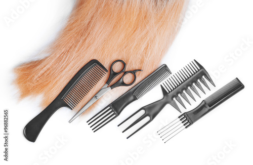 hair with scissors on close up isolated on white background