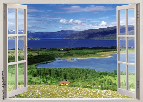 Open window view to landscape with river, hills and fields