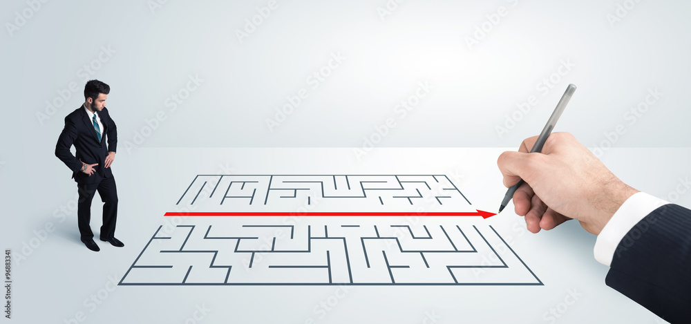 Business man looking at hand drawing solution for maze Business man looking at hand drawing solution for maze