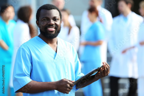 Handsome smiling doctor wit...