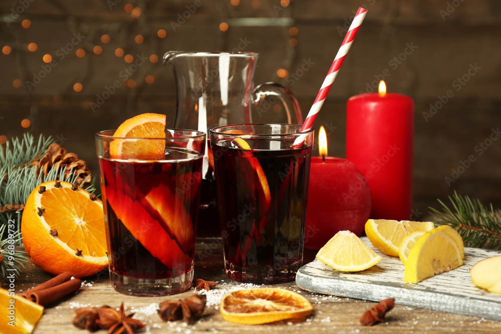 Decorated composition of mulled wine in glasses on wooden table Decorated composition of mulled wine in glasses on wooden table