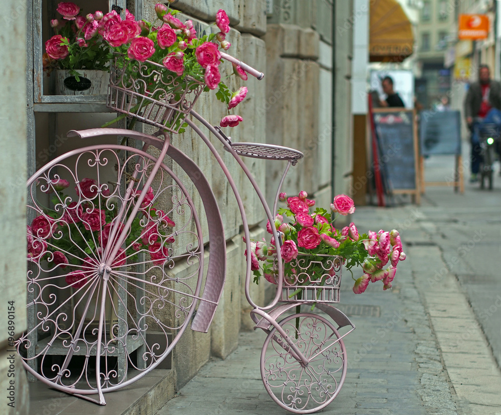 City design: flower basket in the form of antic bicycle