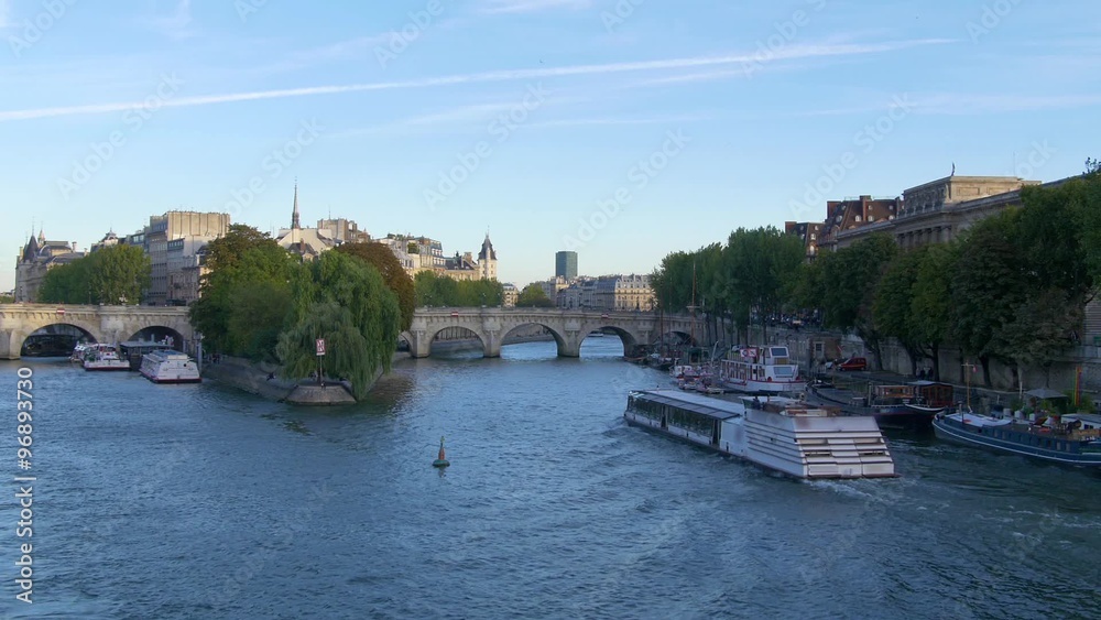 Paris, view of Pont Neuf and the river Seine with riverboat cruising
