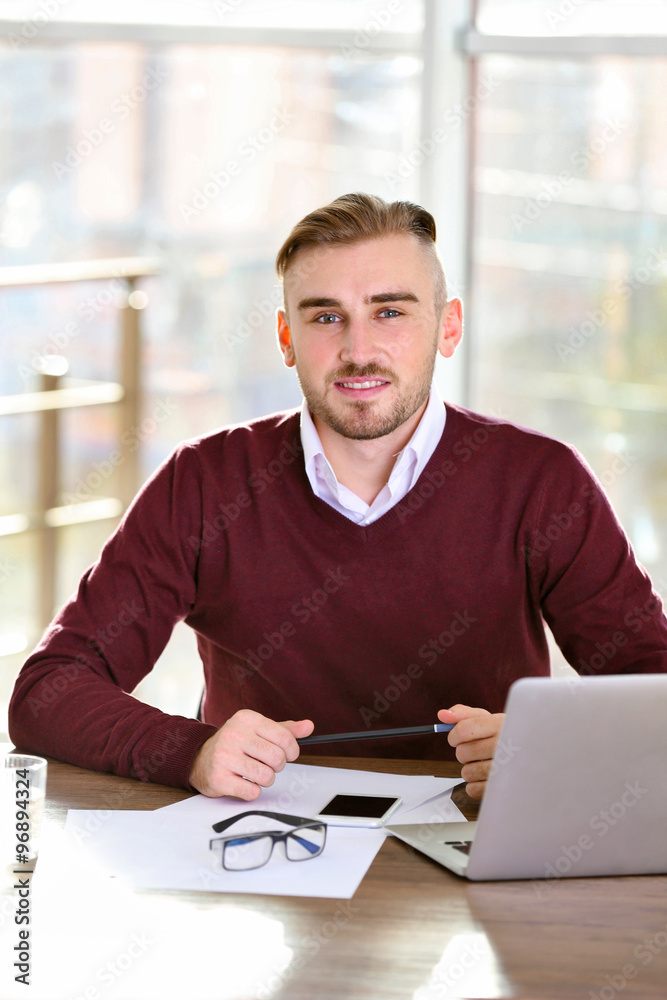 Businessman working with laptop in office Businessman working with laptop in office